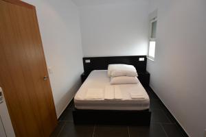 Postel nebo postele na pokoji v ubytování INMOMILCASAS APARTAMENTOS
