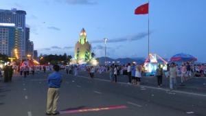 a large crowd of people walking down a street at Hotel Hồng Hạc nha trang in Nha Trang