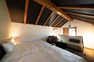 Säng eller sängar i ett rum på Iizukatei