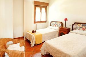 Postel nebo postele na pokoji v ubytování Apartamentos El Pajar del Abuelo