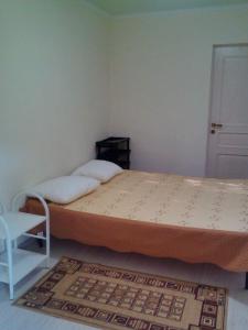 Кровать или кровати в номере База отдыха и Автокемпинг "На Первом"