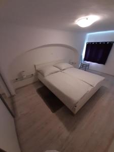 Ein Bett oder Betten in einem Zimmer der Unterkunft Apartment Osk