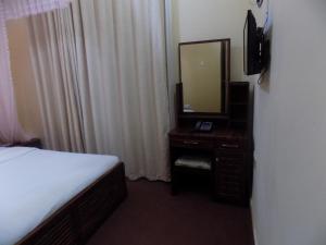 TV a/nebo společenská místnost v ubytování Belline Hotel Ishaka