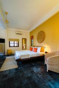 Кровать или кровати в номере Rambutan Resort – Siem Reap