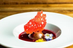 a piece of dessert on a white plate on a table at Golden Crown - Levin Iglut in Levi +45 photos