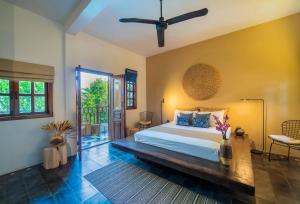 Кровать или кровати в номере Rambutan Resort – Siem Reap +37 фотографий