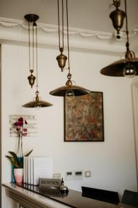 a room with several lights hanging from the ceiling at Hotel Majestic in Budva