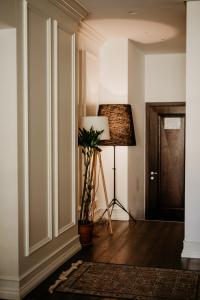 a hallway with a floor lamp and a lampost at Hotel Majestic in Budva