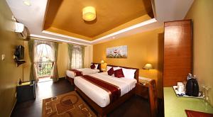 Voodi või voodid majutusasutuse DOM Himalaya Hotel toas