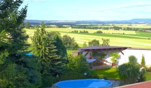 an aerial view of a house with a pool at Penzion Rogallo in Hořičky