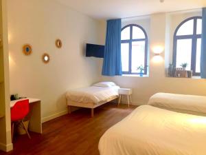 Giường trong phòng chung tại Le Clocher de Rodez Centre Gare