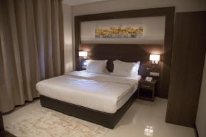 Кровать или кровати в номере Emerald Residence