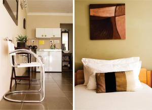 a room with a bed and a kitchen at Haus Holzapfel in Beaufort West