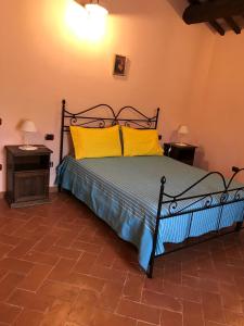 Postel nebo postele na pokoji v ubytování Agriturismo podere Casano