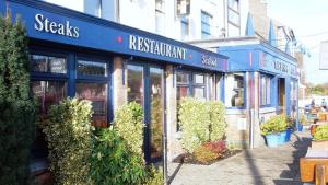 a storefront of a restaurant on a city street at The Bosun in Monkstown
