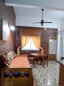 a living room with a table and a bed at Apartamento Agustín in San Bernardo