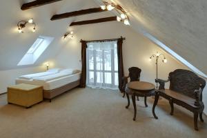 Posteľ alebo postele v izbe v ubytovaní Zamecka Fortovna Obora - Forester House