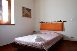 Postel nebo postele na pokoji v ubytování Casa Il Ceppo