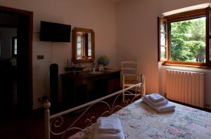 Postel nebo postele na pokoji v ubytování Casa Il Ceppo