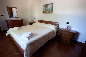 Postel nebo postele na pokoji v ubytování Casa Il Ceppo