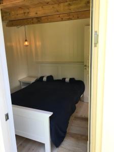 Postel nebo postele na pokoji v ubytování Sommerhus i idylliske omgivelser