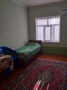 Cama o camas de una habitación en Guest House Nigina