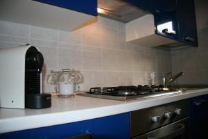 a kitchen with a stove and a counter top at GARAGE36 in Parma