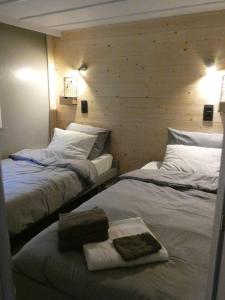 Postelja oz. postelje v sobi nastanitve Vakantiewoning De Kleine Duinberg - Chalet Nr 11