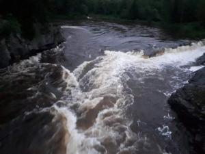 a river with white rapids on top of it at Fossekroa in Svarstad