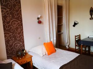 Postel nebo postele na pokoji v ubytování Hotel Ô Fil de L'ô