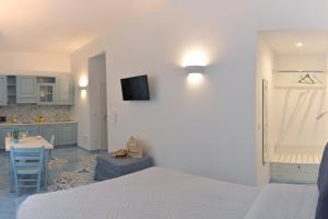 A bed or beds in a room at Una Finestra sul Mare