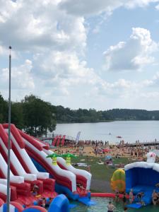 a group of people at a water park at Luxury Camping POD in Zarasai