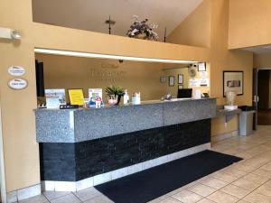 a lobby with a counter in a restaurant at Baymont by Wyndham Fort Wayne in Fort Wayne +46 photos