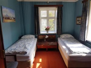 Letto o letti in una camera di Guesthouse Gamli Bær