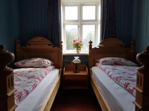 Letto o letti in una camera di Guesthouse Gamli Bær