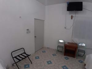 TV a/nebo společenská místnost v ubytování Habitaciones Chiquil Ha