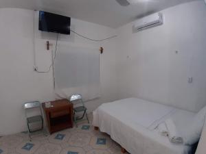 Postel nebo postele na pokoji v ubytování Habitaciones Chiquil Ha