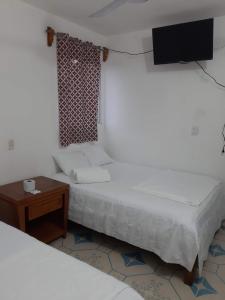 Postel nebo postele na pokoji v ubytování Habitaciones Chiquil Ha