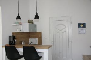 Kuchyň nebo kuchyňský kout v ubytování Stylish Apartment in City Center