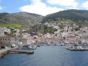a view of a town with boats in the water at Hydra's Ruby in Hydra