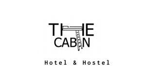a logo for a hotel and hostel at The Cabin in Amman
