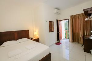 En eller flere senge i et værelse på Hotel Mediterraneo Inn + 31 billeder