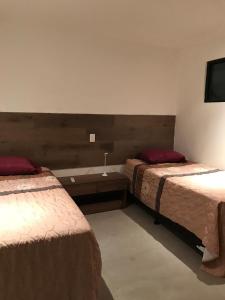 Ein Bett oder Betten in einem Zimmer der Unterkunft APARTAMENTO CON LA MEJOR VISTA DE SAN SALVADOR