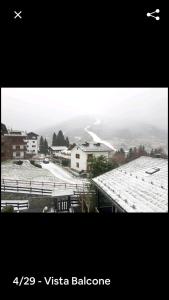 a picture of a snow covered roof of a house at bormio appartamento panoramico in Bormio