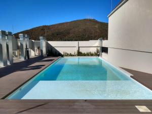 a swimming pool on the side of a building at Cono de Arita in Salta