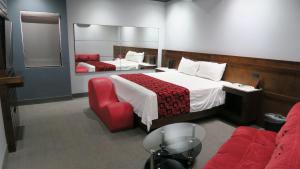 מיטה או מיטות בחדר ב-Motel Boutique Xpress