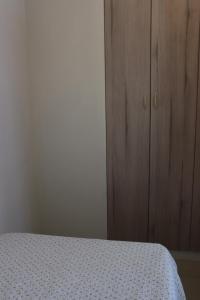 Postel nebo postele na pokoji v ubytování Cayma Apart's II