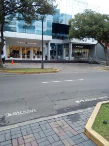 an empty street in front of a building at Teté in Lima
