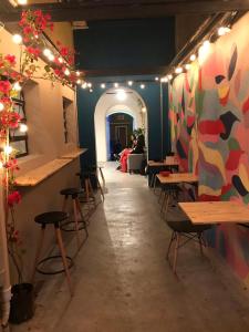 a room with tables and chairs in a restaurant at Imagina Hostel in Sao Paulo
