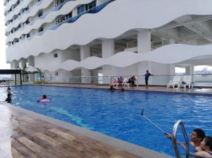 a swimming pool on the side of a cruise ship at The Wave Residence in Malacca